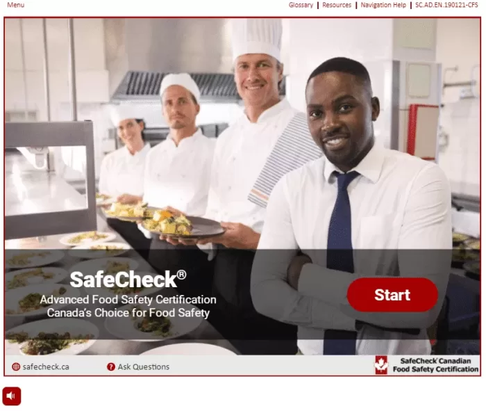 four people standing in a restaurant kitchen