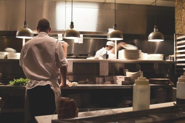 Several chefs working in a restaurant kitchen