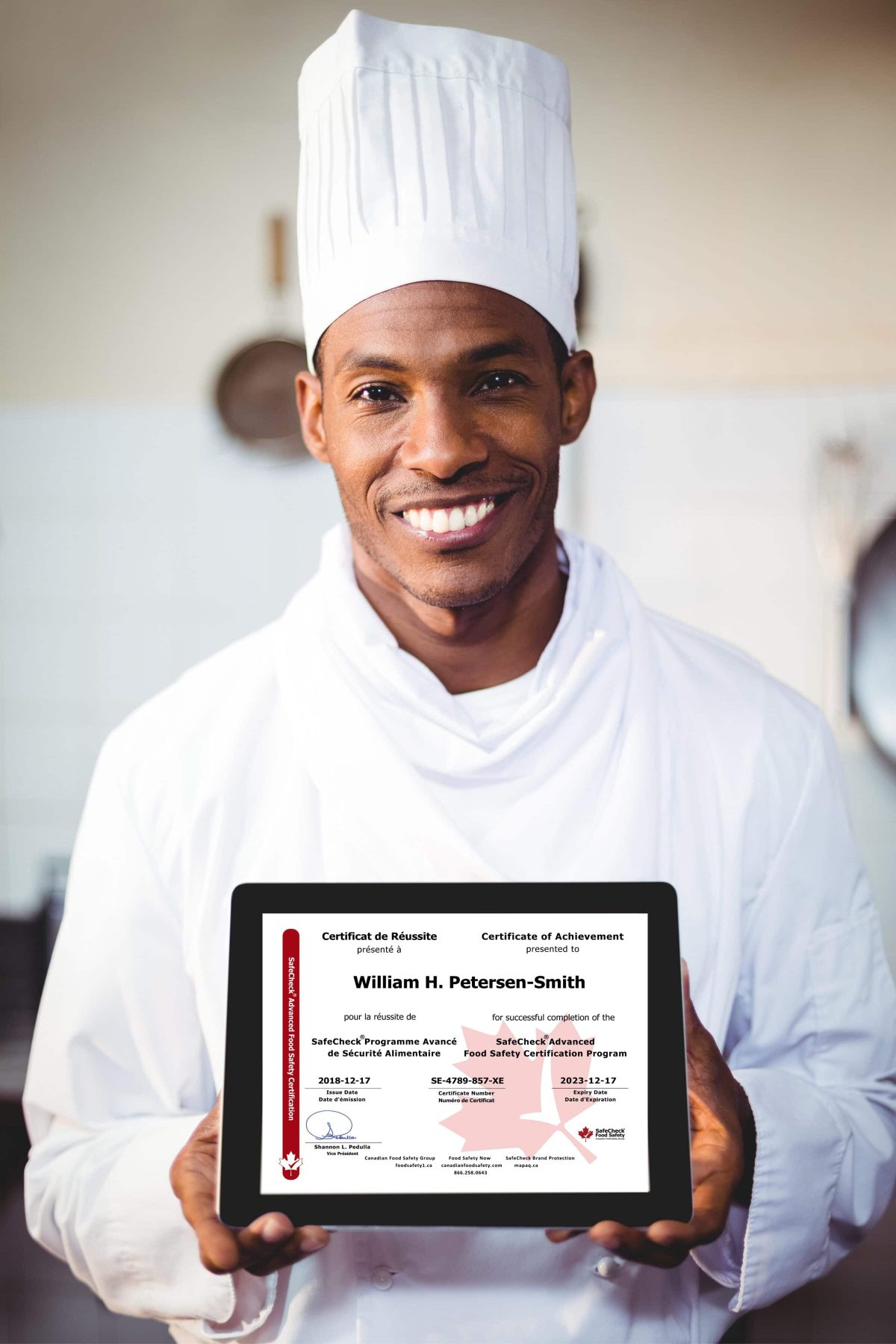 a chef holding a certificate