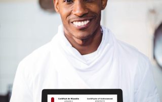 a chef holding a certificate